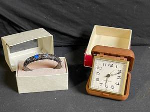 lot 275 image: Westclox Travel Alarm Clock in Brown Case & Filigree Bracelet with Blue Stones