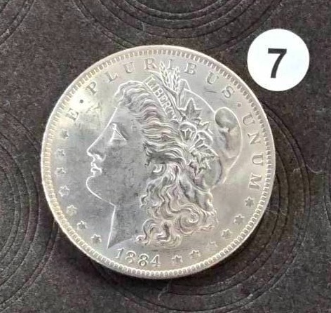 lot 7 image: 1884-0 BU Morgan Silver Dollar