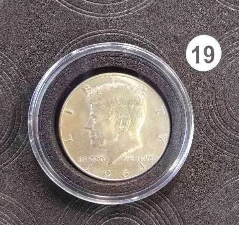 lot 19 image: 1964 Kennedy Silver Dollar