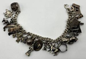 lot 119N image: Sterling Silver Charm Bracelet with Western and Themed Charms