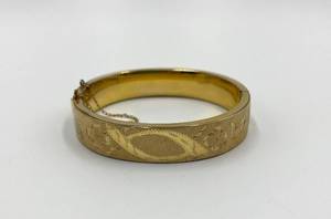 lot 125N image: Gold Toned Hinged Bangle Bracelet with Floral Engraving