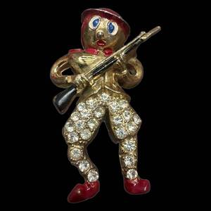 lot 197 image: Gold-Tone Rhinestone Military Figure Pin With Rifle - Broken Pin Area