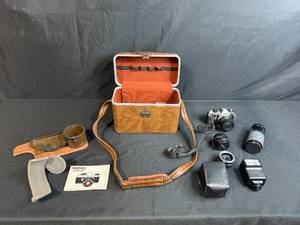 lot 16 image: Pentax ME Super 35mm SLR Film Camera Set with Lenses, Flash, Case, and Manual