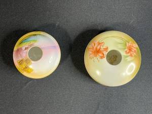lot 46 image: Pair of Hand Painted Nippon Porcelain Hair Receivers with Floral and Landscape Designs