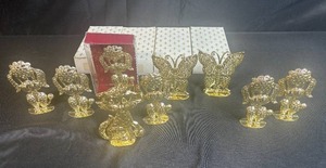 lot 103 image: Collection of Gold Tone Metal Animal Figurines Earring Displays with Boxes