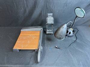 lot 118 image: X-Acto Paper Cutter, Clip-On LED Lamp, and Desk Magnifier Lot