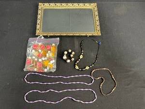 lot 236 image: Vintage Ornate Metal Mirror Tray, Jewelry Assortment, and Mini Perfume Bottles