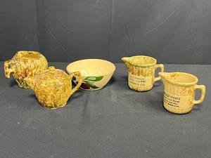 lot 242 image: Collection of Vintage Stoneware Creamers, Teapot, and Advertising Bowls