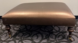 lot 33A image: CopperBrass Colored Covered Ottoman Footstool with Turned Wood Legs & Casters