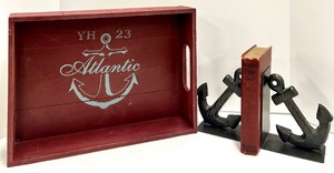 lot 413 image: Atlantic Anchor Tray - 2 Black Anchor Bookends & Red Reilly & Lee White Fire Shell Book