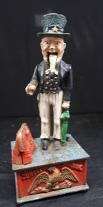 lot 9 image: VINTAGE CAST IRON UNCLE SAM BANK