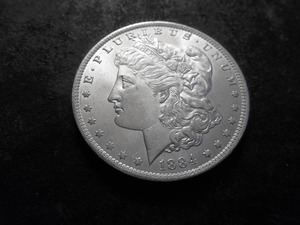 lot 11 image: 1884 O Morgan Silver Dollar