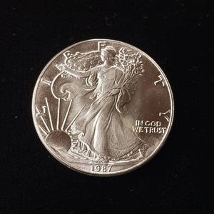 lot 4 image: 1987 Silver Eagle - 99.9% pure silver� One Troy Ounce  - Like new uncirculated TAX EXEMPT