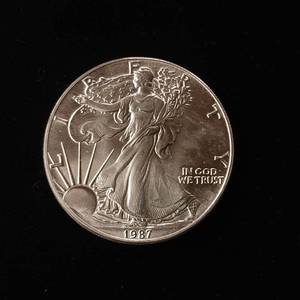 lot 9 image: 1987 Silver Eagle - 99.9% pure silver� One Troy Ounce  in pristine condition - TAX EXEMPT