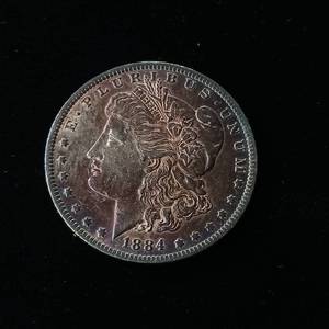 lot 16 image: 1884O Morgan Silver Dollar � 90% Silver - TAX EXEMPT