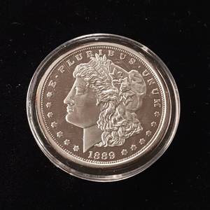 lot 28 image: Replica Copy 1889 Morgan Silver Dollar � 1 troy ounce 99.9% Silver � Tax Exempt