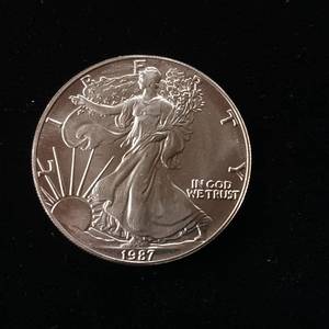 lot 83 image: 1987 Silver Eagle - 99.9% pure silver� One Troy Ounce  - Like new uncirculated - TAX EXEMPT