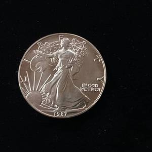 lot 103 image: 1987 Silver Eagle - 99.9% pure silver� One Troy Ounce  - Like new uncirculated - TAX EXEMPT