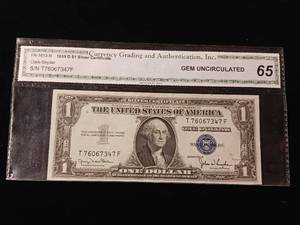 lot 124 image: 1935-D $1 Silver Certificate � Gem Uncirculated � Grade 65 by Currency Grading and Authentication - TAX EXEMPT