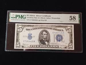 lot 192 image: 1934A - $5 Dollar Silver Certificate � 58 Choice about Uncirculated -  PMG Paper Money Guarantee - TAX EXEMPT � Blue Seal