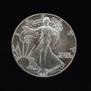 lot 209 image: 1987 Silver Eagle - 99.9% pure silver� One Troy Ounce  - Like new uncirculated TAX EXEMPT � Bright and detailed