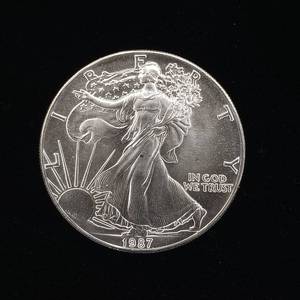 lot 257 image: 1987 Silver Eagle - 99.9% pure silver� One Troy Ounce  - Like new uncirculated TAX EXEMPT � Bright and detailed