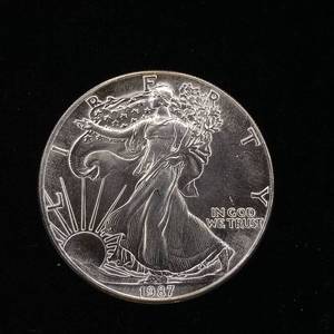 lot 259 image: 1987 Silver Eagle - 99.9% pure silver� One Troy Ounce  - Like new uncirculated TAX EXEMPT � Bright and detailed