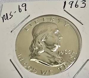 lot 71 image: 1963 Franklin Half Dollar, graded MS-69