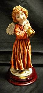 lot 531 image: Cherub with Bell by Giuseppe Armani (signed 1979) in Florence Italy Handcrafted with 24 Kt Gold Accents, Oval Picture Frame by Bucklers Inc. Fifth Ave. NY