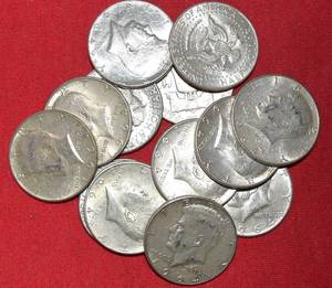 lot 569 image: Thirteen (13) 90% KENNEDY HALF DOLLARS
