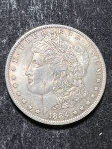 lot 26 image: 1884-O US MORGAN SILVER DOLLAR