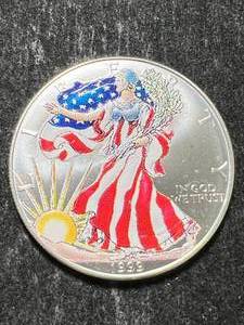 lot 50 image: 1999 AMERICAN SILVER EAGLE 1 TROY OZ .999 FINE SILVER IN COLOR