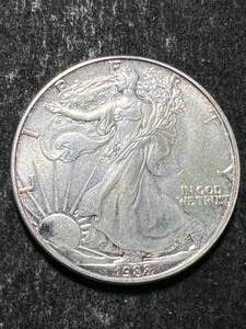 lot 62 image: 1988 AMERICAN SILVER EAGLE 1 TROY OZ .999 FINE SILVER
