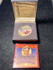 lot 70 image: 1999 AMERICAN SILVER EAGLE 1 TROY OZ .999 FINE SILVER IN COLOR