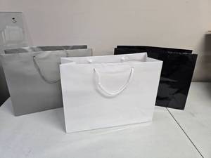 lot 39 image: Platinum Matte, White & Black Gloss 16 x 6 x 12 Gift Bags