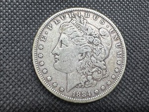 lot 23 image: 1884 Morgan Silver Dollar