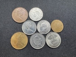 lot 56 image: Eight High Quality Foreign Coins, including an 80% Silver Canadian Quarter