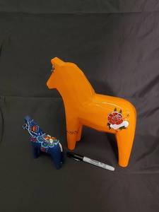 lot 73 image: Dala Horse - Hand-Painted Wooden Horses (Orange & Blue) (Lot of 2)