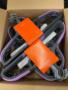 lot 4 image: Amazon Basics 50-Pack Plastic Clothes Hangers