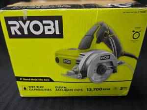 lot 40 image: Ryobi 4 Hand Held Tile Saw