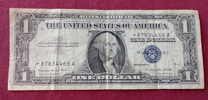 lot 43 image: 1957 Silver Certificate $1 Star Note