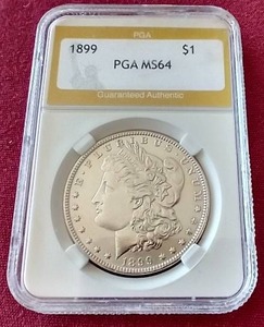 lot 63 image: 1899 Morgan Dollar - PGA MS64 - Rare Date