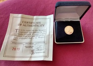 lot 95 image: Miniature Replica 3 Grain Gold Krugerrand