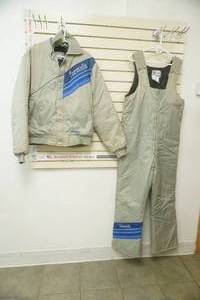 lot 55 image: Vintage Ski-Doo Formula Snowmobile Jacket and Bib Set in Light Grey with Blue Stripes. New condition.