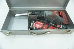 lot 313 image: Milwaukee Sawzall and Metal case wextra blades