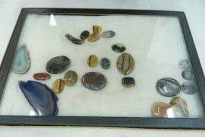 lot 336 image: Polished Stones and Sliced Agates in Glass Case