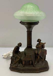 lot 3 image: Est. $175.00- $325.00 1930s Art Deco RadioTable Lamp With  Deep Coppery Bronze Tone With Grand Piano And Banjo Player And Embossed Uranium Glass Shade (Works)