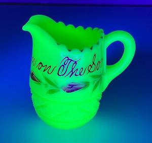lot 31 image: 1900-1920s Heisey Custard GlassVaseline Glass Novelty Souvenir Eckman On The Soo  Railroad Small Creamer 3 14 (GLOWS) (Small Chip Present On Spout