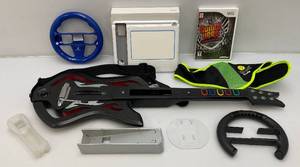 lot 130 image: Vintage WII Guiltar hero Warriors Of Rock Game, Guitar And Other Wii Accessories