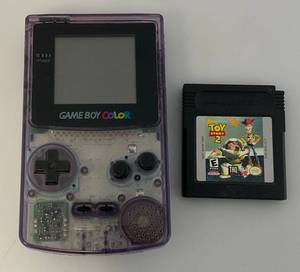 lot 136 image: Vintage Game Boy Color With Toy Story 2 Game (Missing Battery Cover) Untested